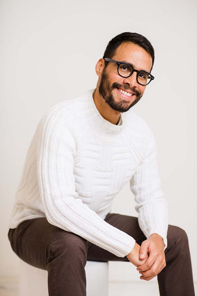 dating-site-pictures-man-in-glasses-white-chunky-jumper-smiling